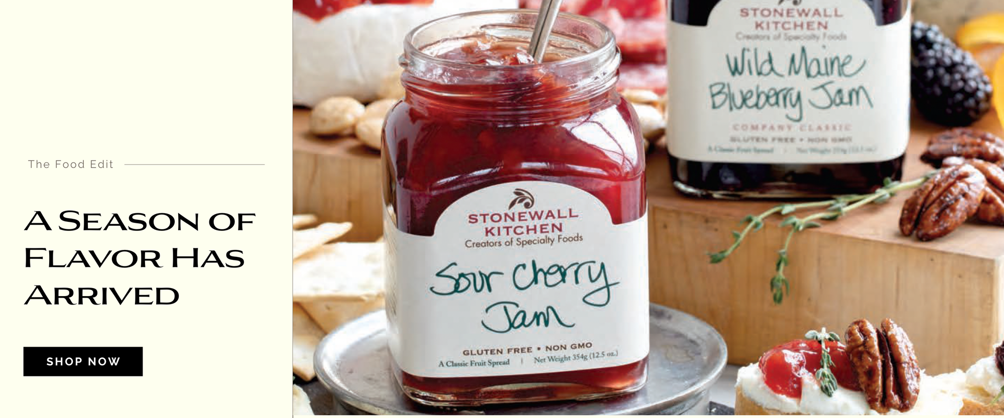 Stonewall Kitchen jam jars with labels on a table with food.